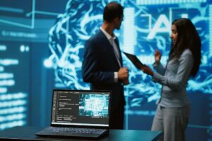 Focus on laptop in workspace used by AI researchers working with artificial intelligence in blurry background.
